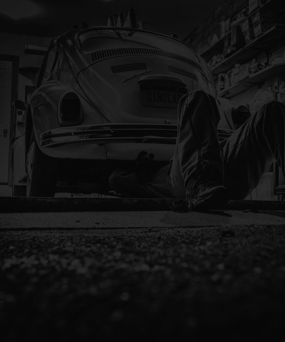 Technician working on a convertible roof system in the Arncliffe workshop