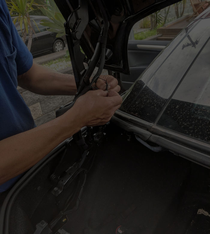 Sunroof mechanism opened up for guide and cable inspection